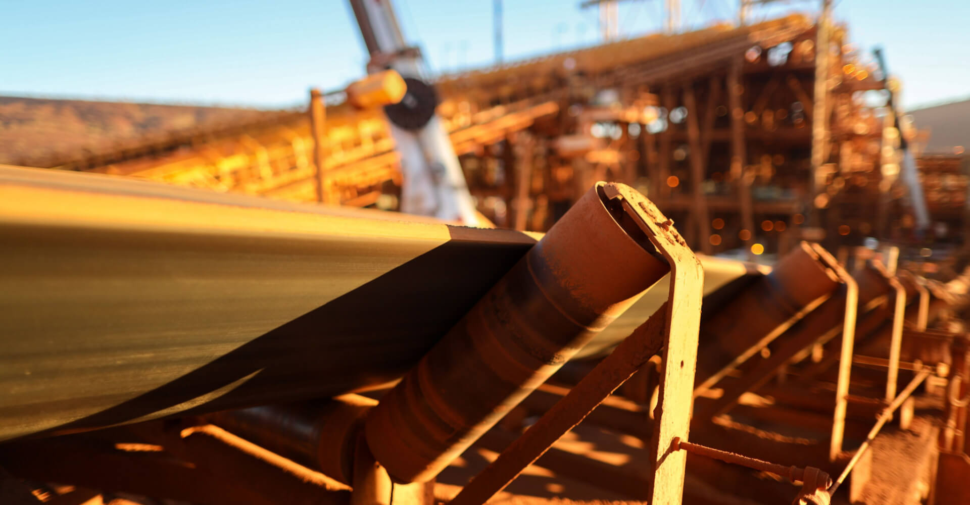 Conveyor belt and rollers structures line machinery its transfer iron ore into material screen house construction mine site, Sydney, Australia